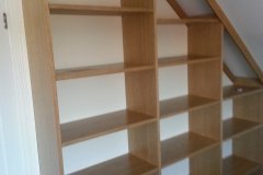 Oak veneer bookcase side-on